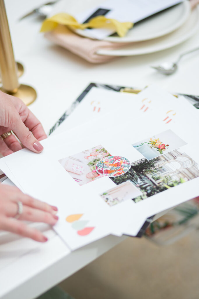 Wedding planner holding the pages of a wedding concept design 